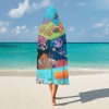 Arctic Velvet Cloak Hooded Blanket featuring underwater coral and fish scene on the beach, perfect for cozy lounging.