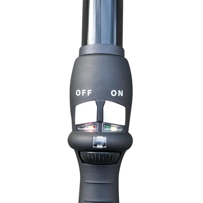 Close-up of temperature regulator and curling iron controls