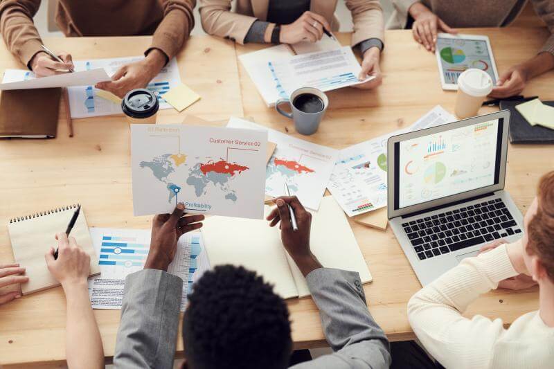 Marketing team reviewing apparel market data.