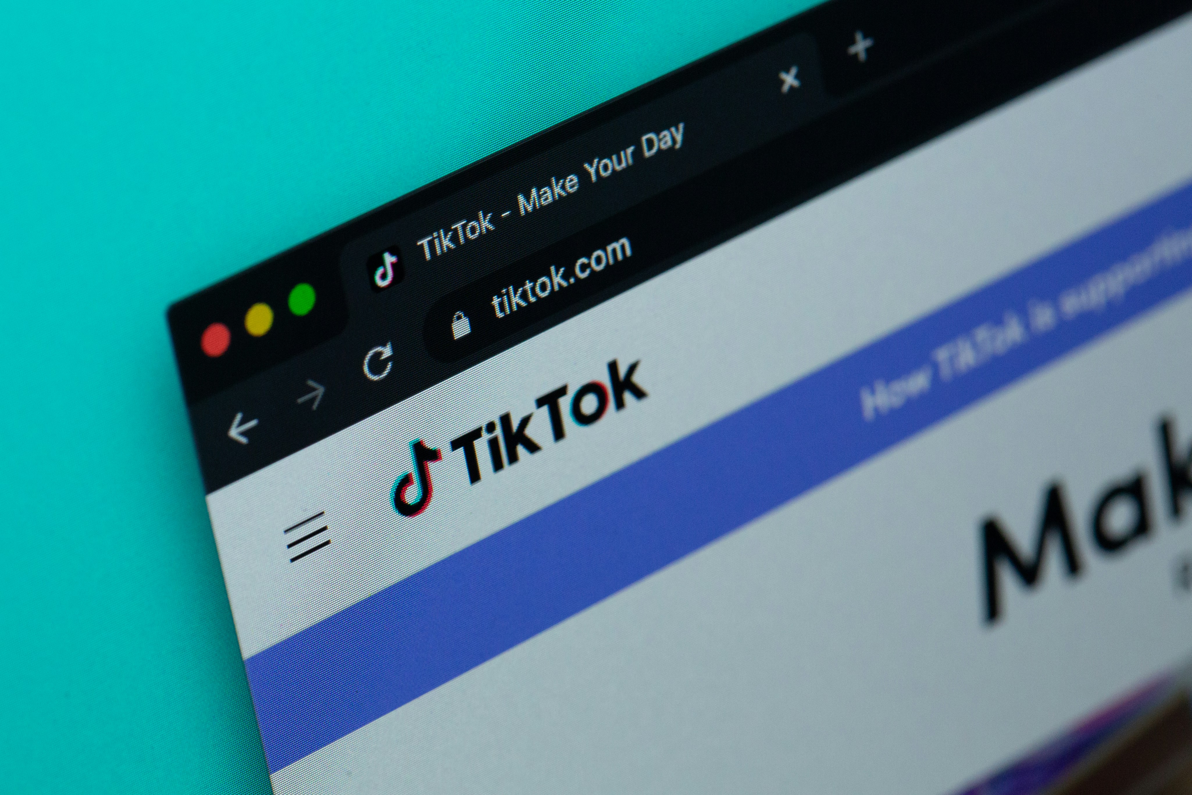 A close-up of a computer screen displaying the TikTok website homepage, highlighting a key social media marketing channel for an EPROLO fashion dropshipping business.