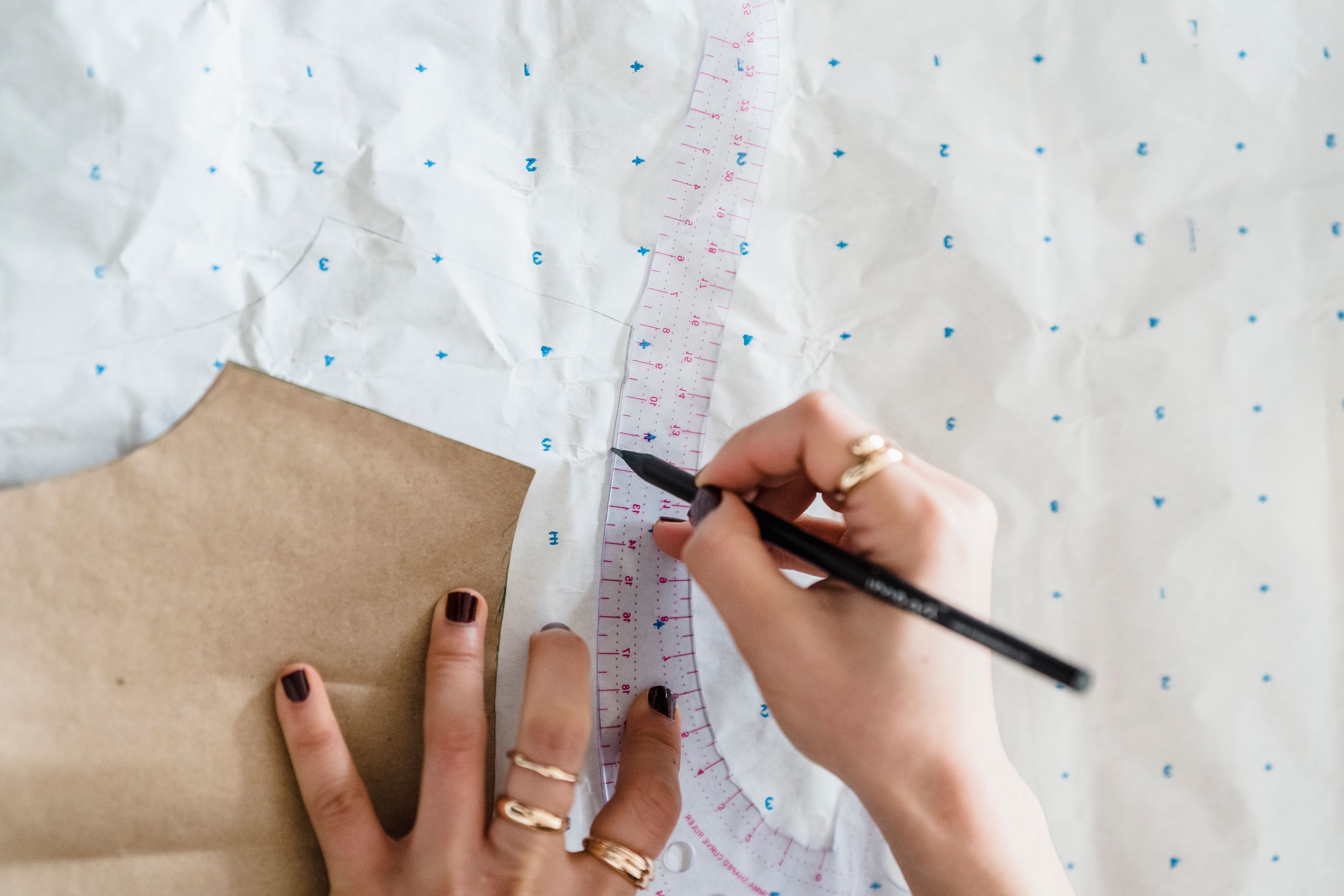 Drawing custom patterns to fix fashion sizing disparities, a standard managed by EPROLO clothing experts.