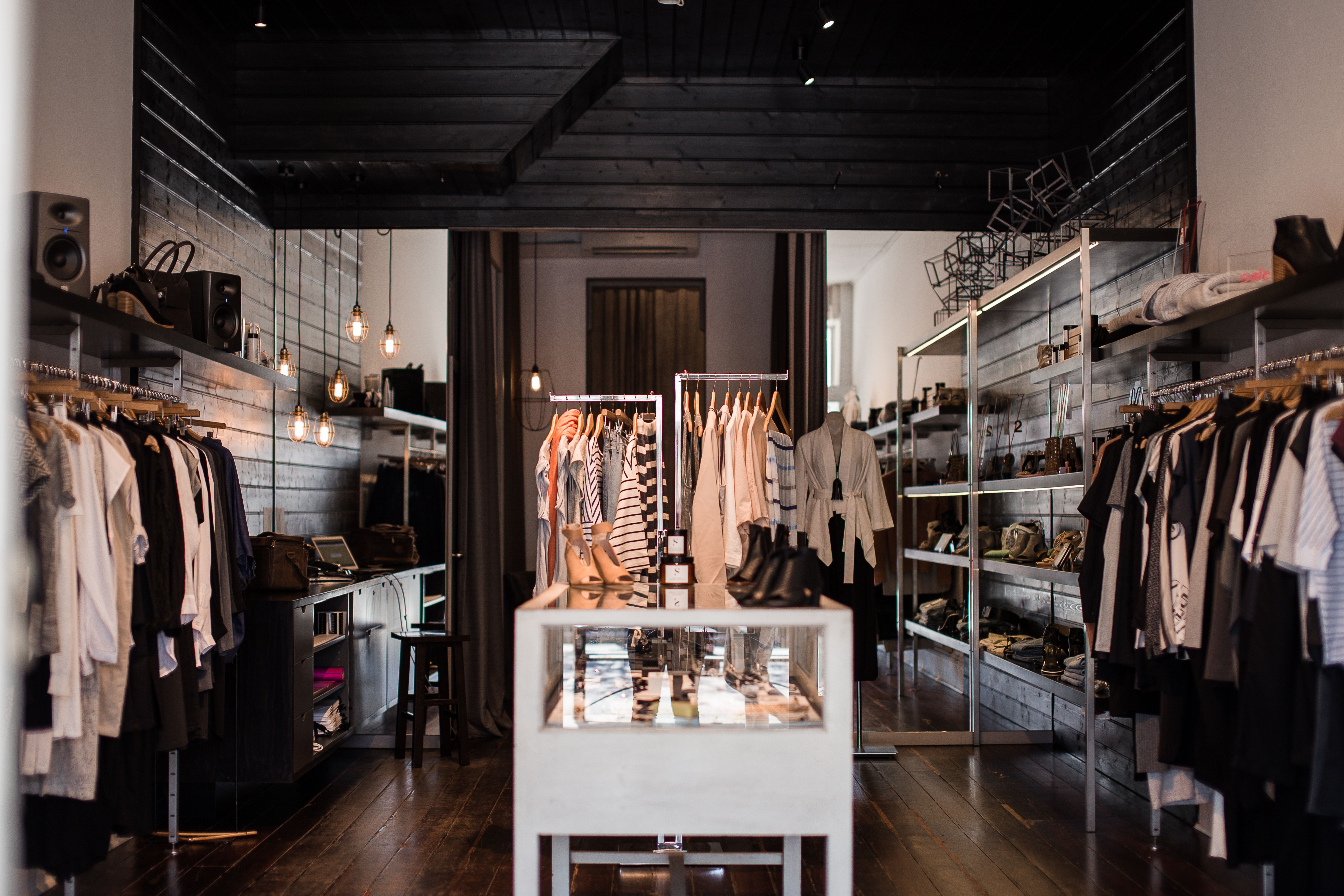 Organizing boutique racks to cross-list clothing inventory and learn how to sell on mercari with EPROLO blog.