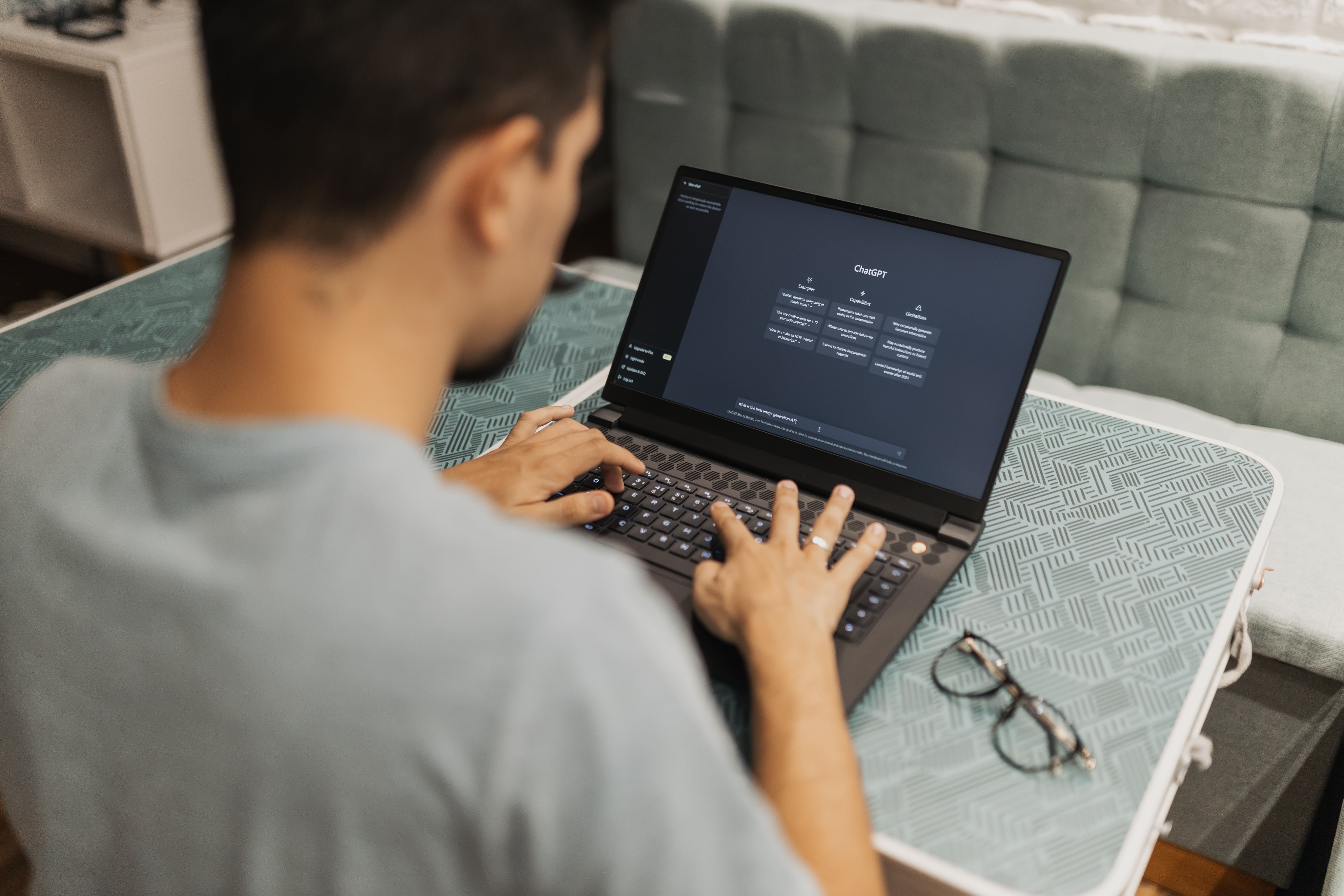 A man typing on a laptop to configure ai dropshipping tools powered by EPROLO software.