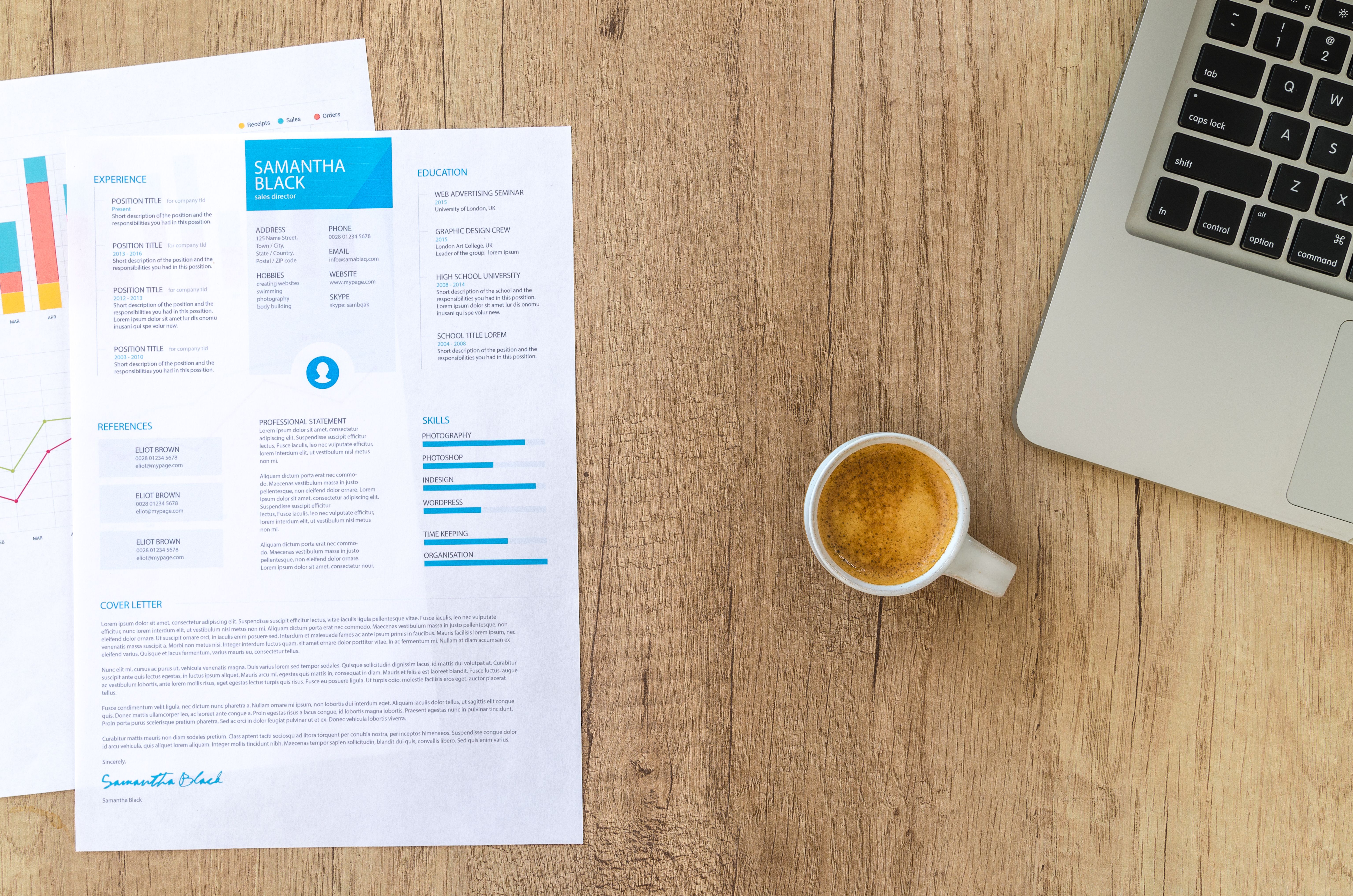 Planning easy businesses to start while reviewing resume documents beside a laptop and coffee.