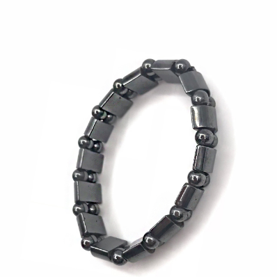 Close-up of magnetic bracelet showing alternating gunmetal and polished chrome segments with magnetic inlays