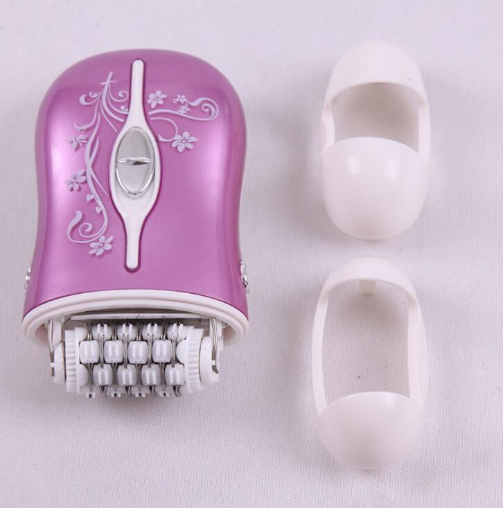 Epilator and two white caps arranged for grooming