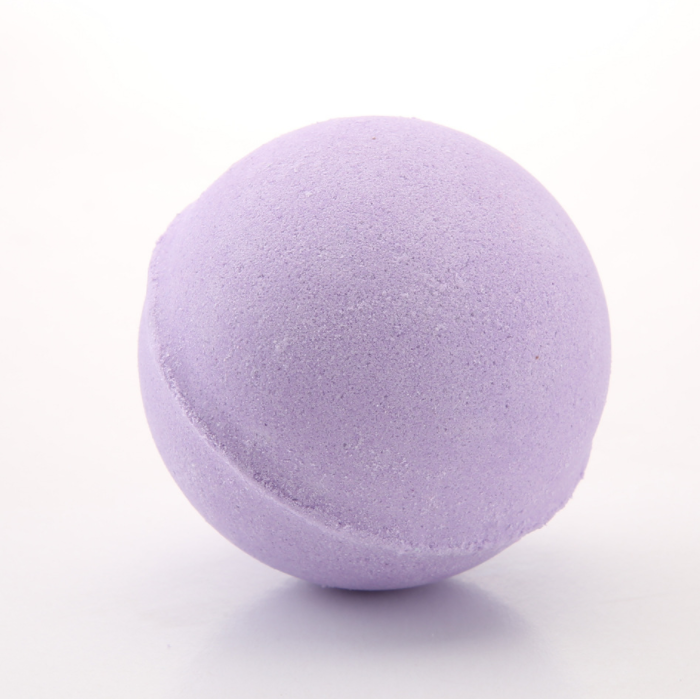 Close-up of a single soft lavender bath bomb on white background