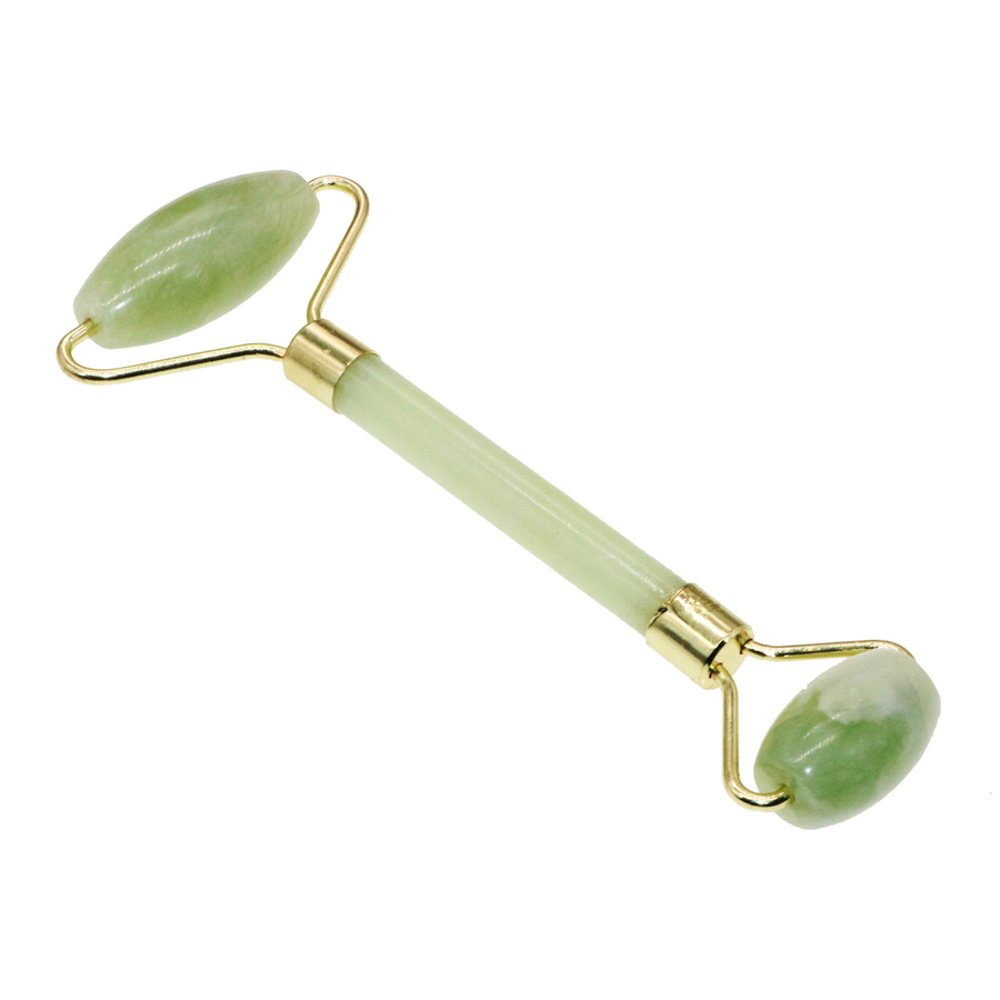 Close-up of polished jade surface and brass ferrule detail