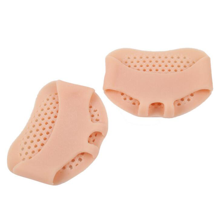 Nude pink silicone pads displayed to show contoured ergonomic design and perforated surface texture