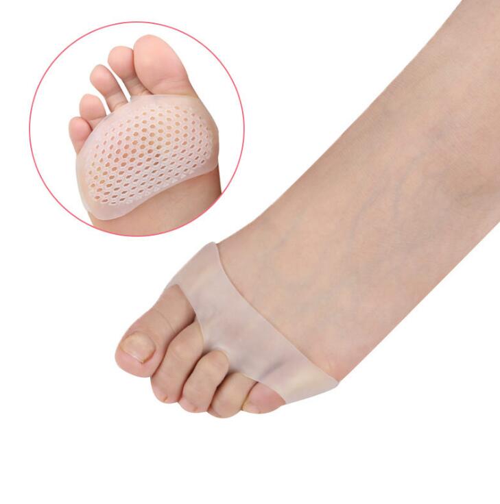 Nude silicone forefoot pad shown on woman's foot demonstrating seamless invisible fit and perforated ventilation pattern
