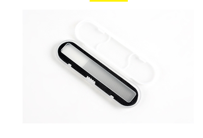 Black nano glass file with frosted glass body and safety guard, presented on a cream surface