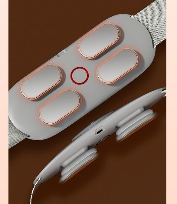 Back view of massager revealing four heating electrode pads with neon pink outlines and central control button, charging cable beside