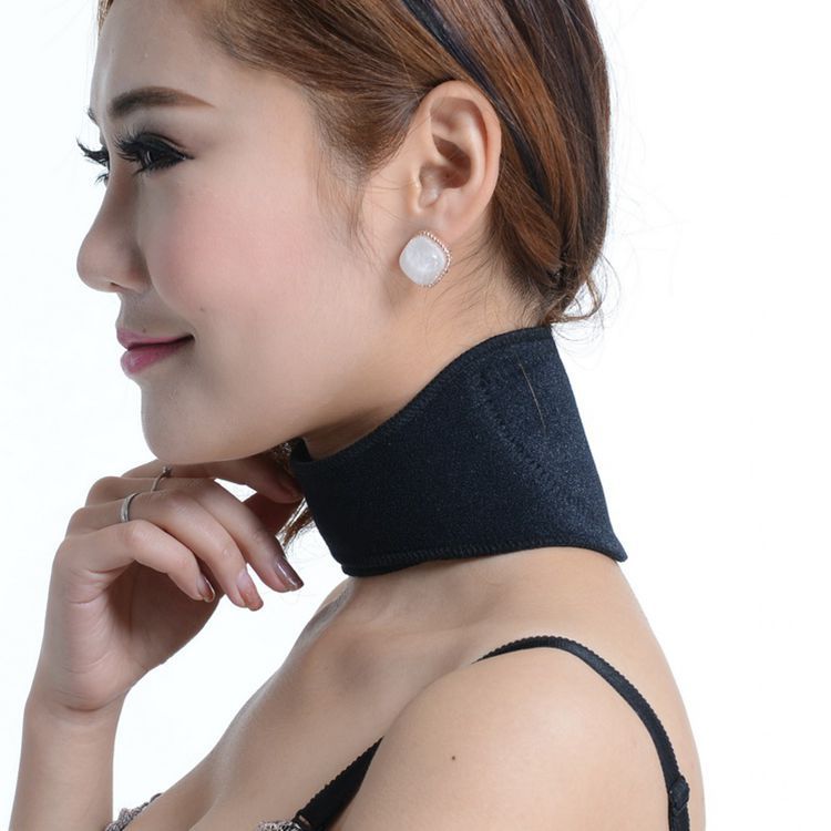 Young woman wearing black self-heating neck support wrap, side profile with natural-looking front coverage
