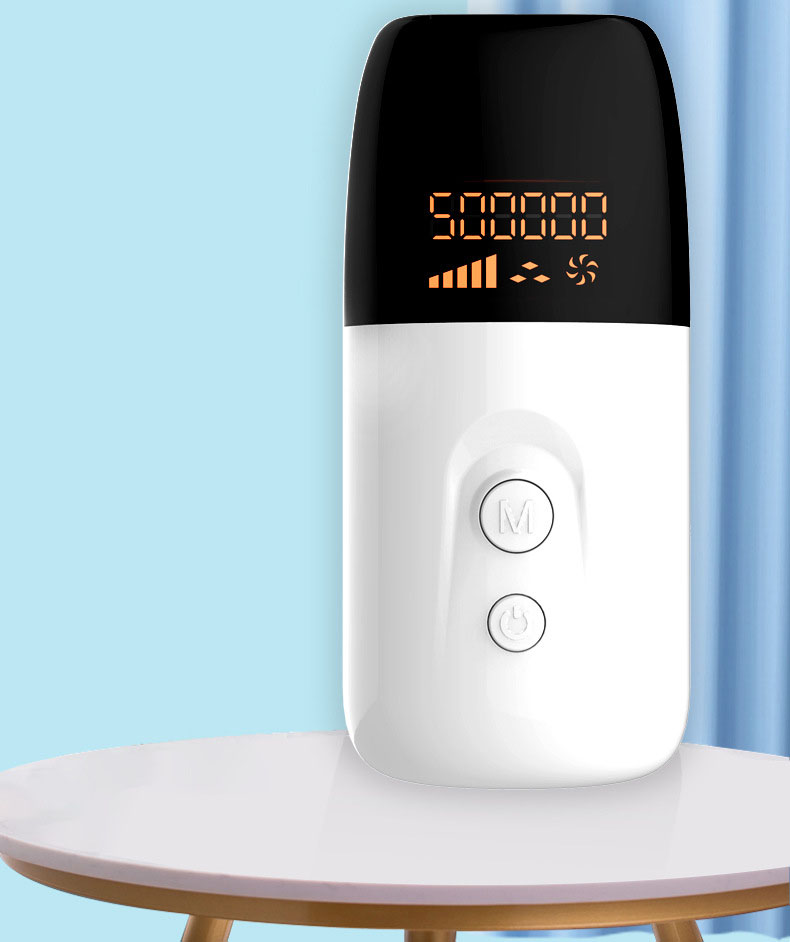 Rounded white and black IPL device on home tabletop