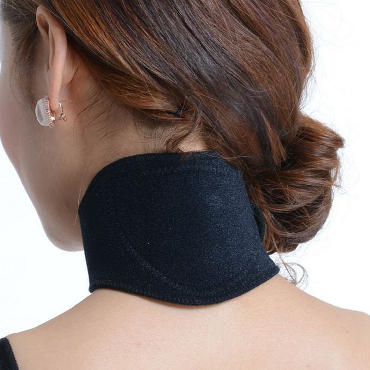 A woman with neck tension, before state, looking uncomfortable with hand on neck