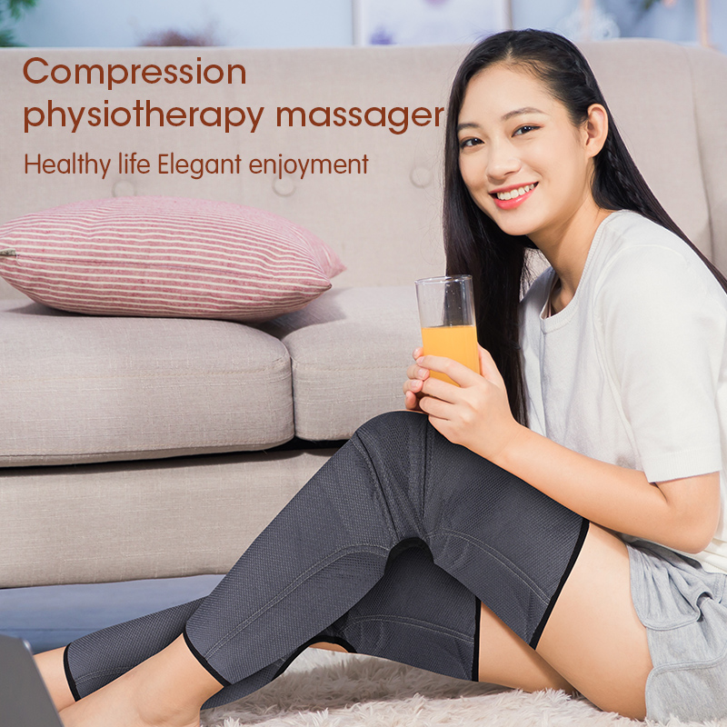 Woman resting on couch with dark compression leg sleeves, holding a drink, looking relaxed in a naturally lit living room