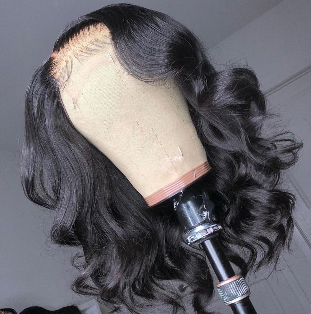 Side view of glossy defined curls and layered bob volume