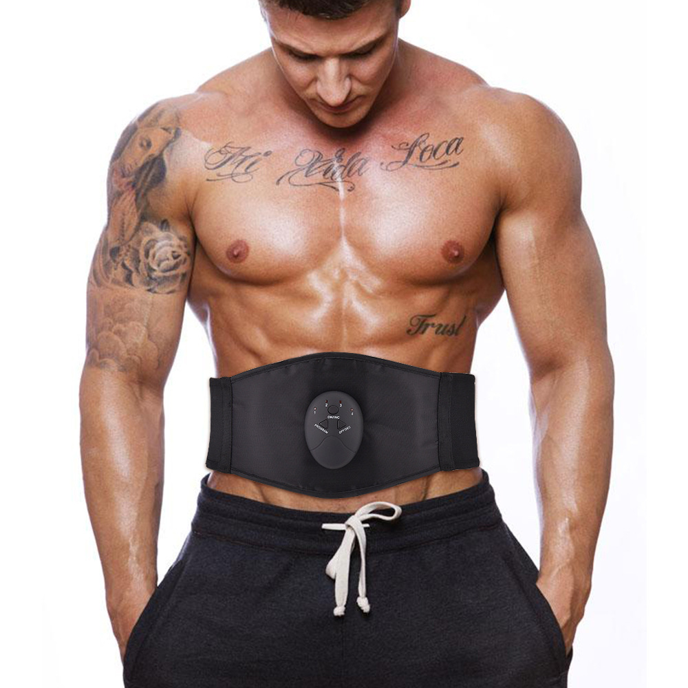 Athletic man wearing black EMS abdominal belt with silver control module