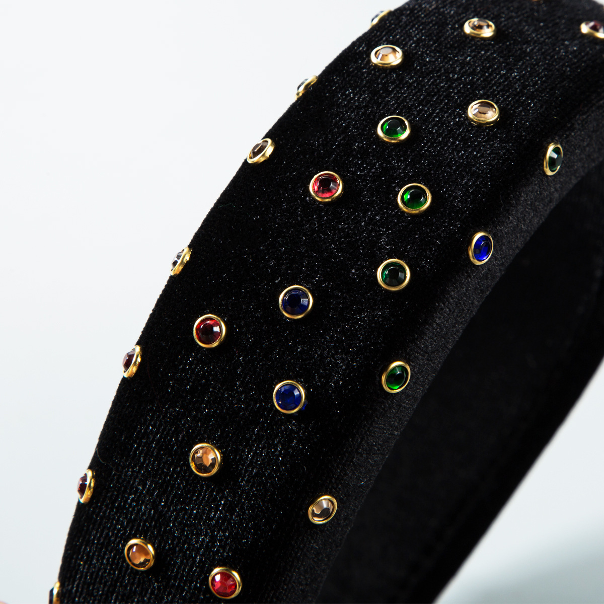 Colorful gold-edged studs across black velvet headband