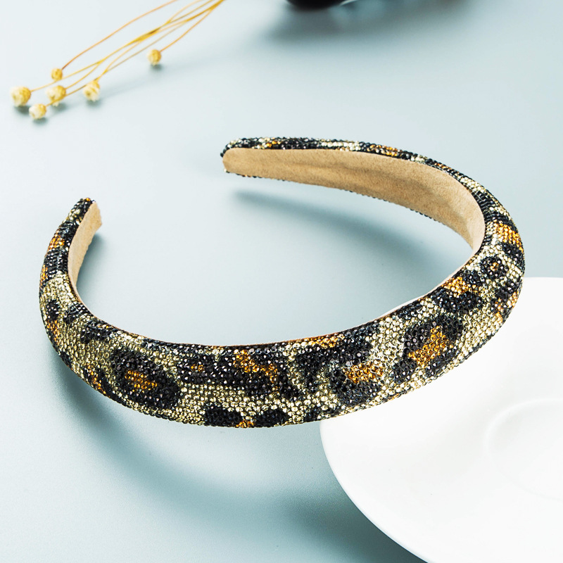 Gold rhinestone hoop showing soft neutral inner lining