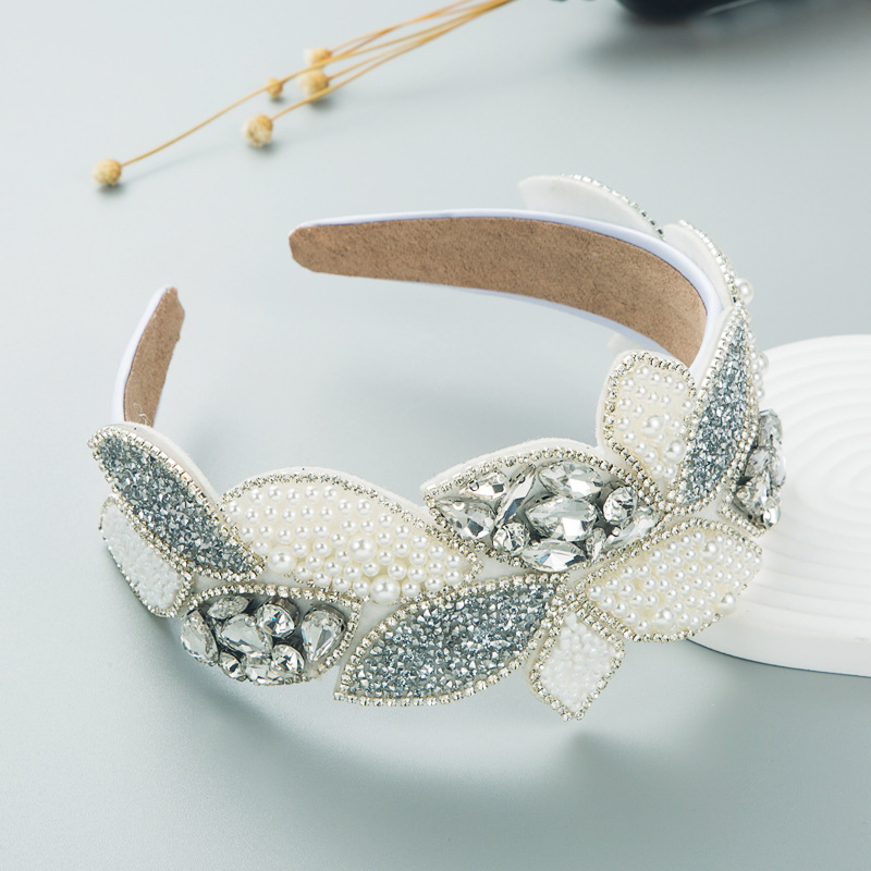 White baroque headband showing sculptural botanical profile