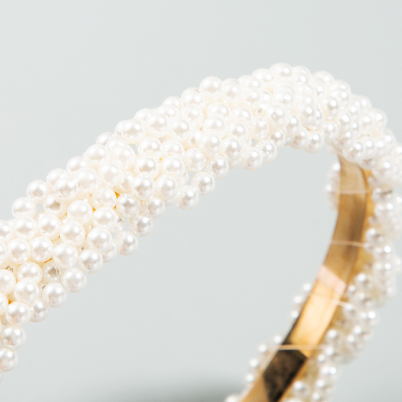 Close-up of densely layered glossy faux pearls