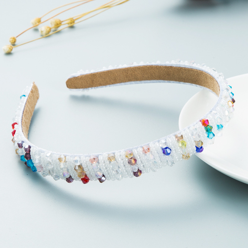 White colorful headband showing flexible open-ended shape