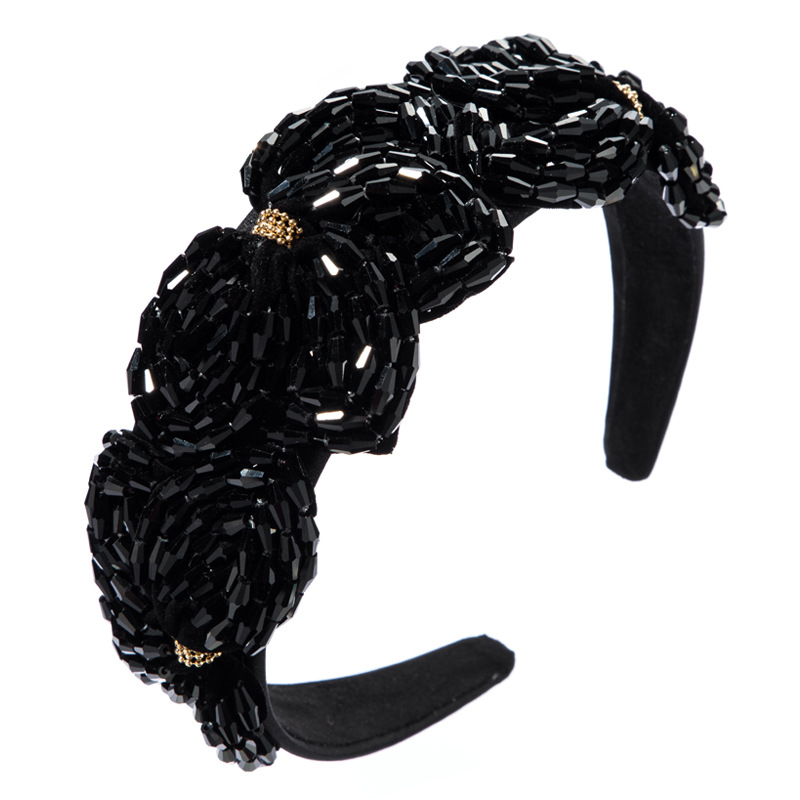 Black wide padded headband with floral embellishment