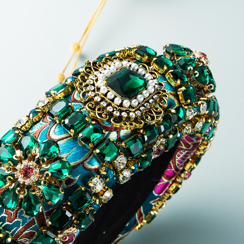 Macro view of pearls gemstones rhinestones and gold filigree