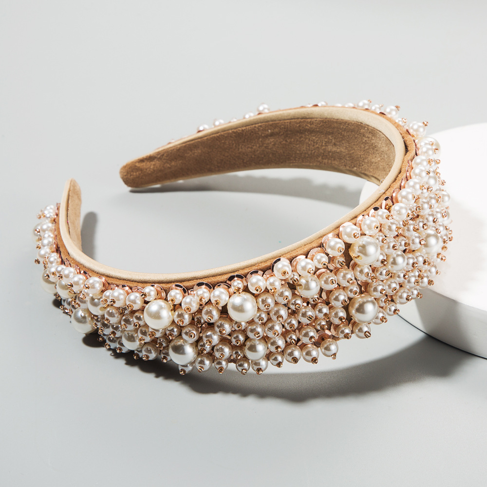 Pearl headband showing warm metallic bead contrast