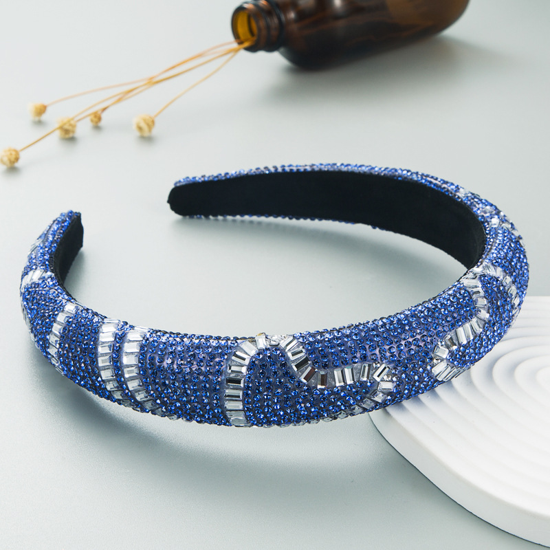 Blue jeweled headband with black inner lining