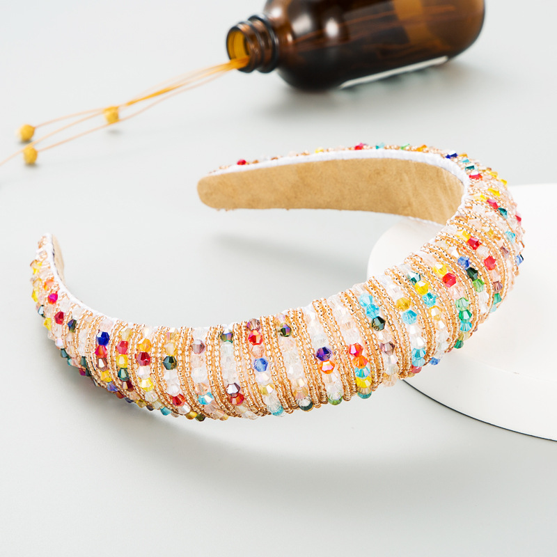 Ivory hoop with reflective hand-woven beadwork