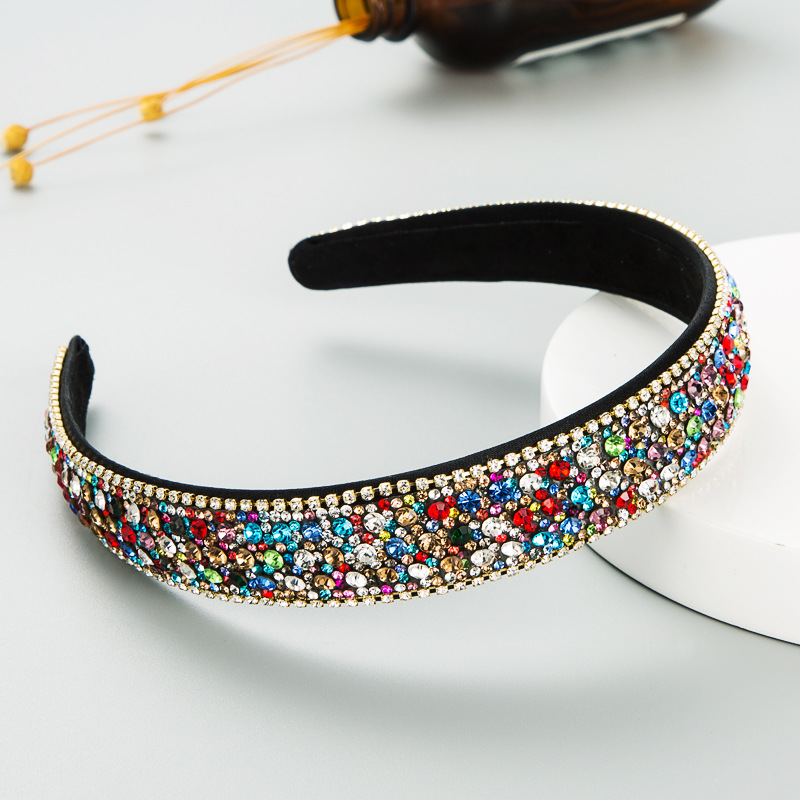Colorful padded headband showing its curved non-slip shape