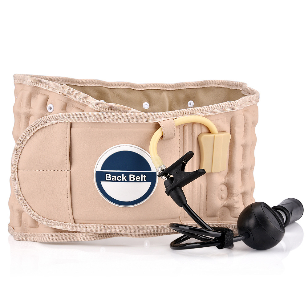 Beige inflatable back belt with integrated pump and adjustment straps displayed on sun-bleached driftwood, soft peach accents