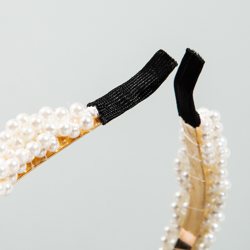 Fabric-covered black tips on pearl hair hoop