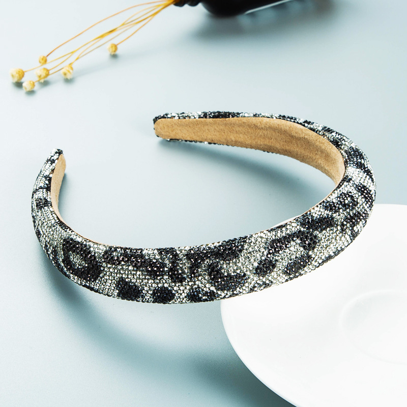 Dense rhinestones across leopard patterned fabric