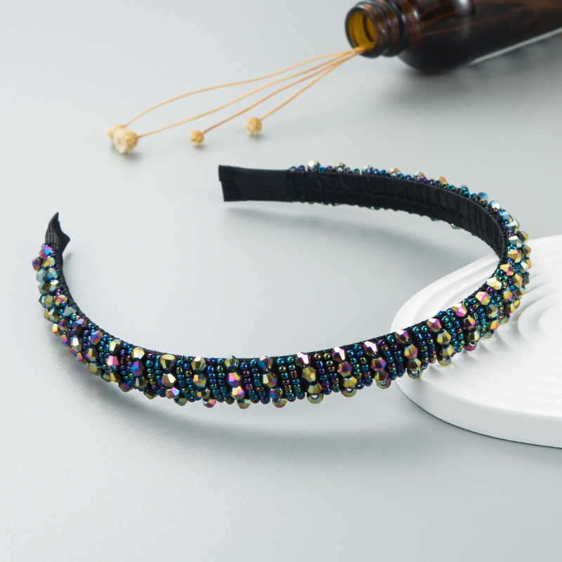 Close view of faceted multicolor woven beads
