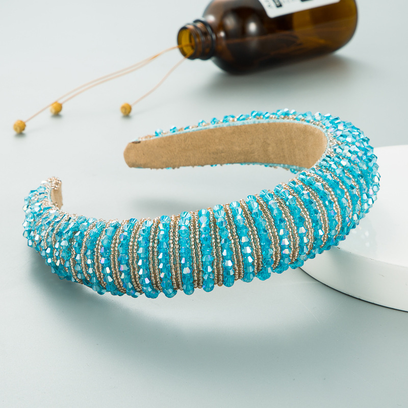 Beaded hair hoop shown in a wearable styling setting