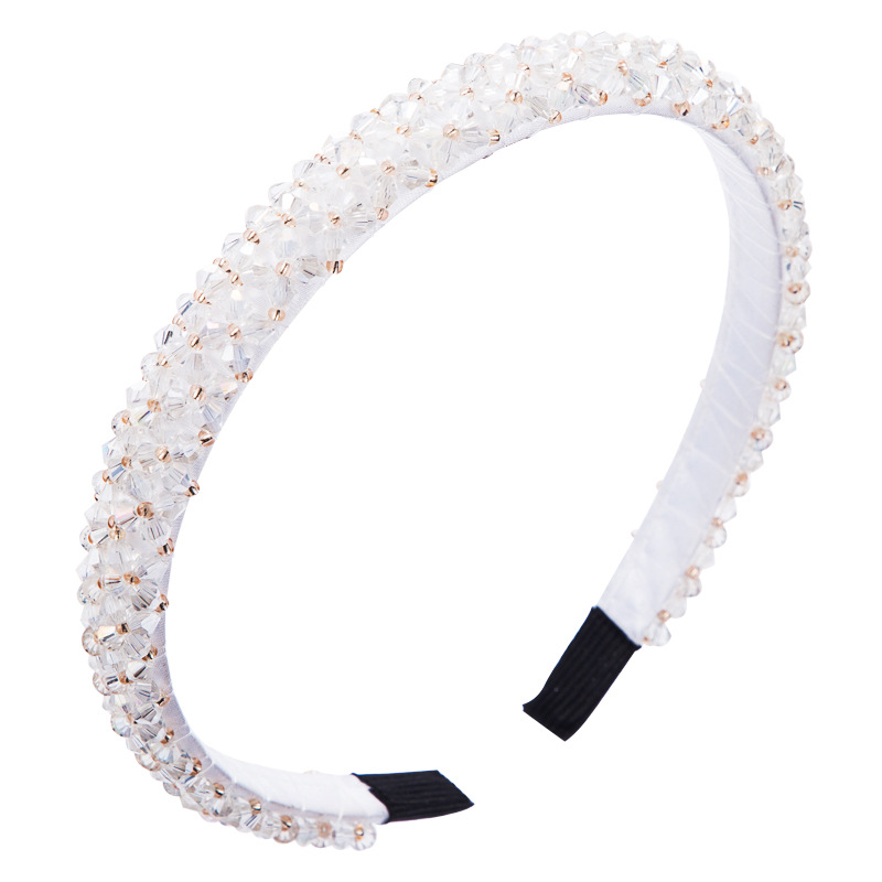Faceted white crystal beads across a slim wrapped band