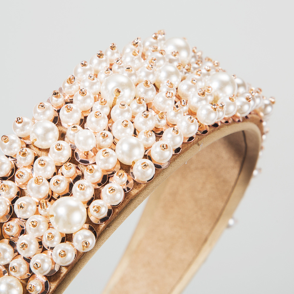 Layered pearls with reflective rose-gold bead details