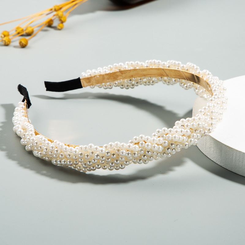 Flexible open hoop headband resting on tabletop