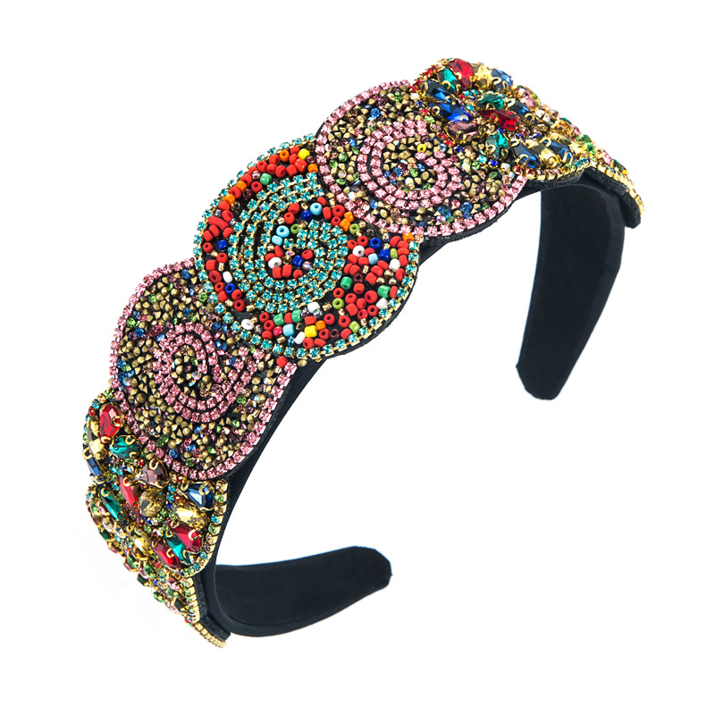 Wide padded black headband with ornate beadwork