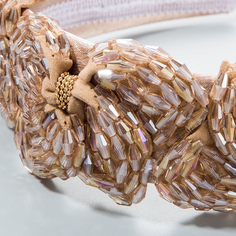 Faceted crystals and gold bead accents in close detail