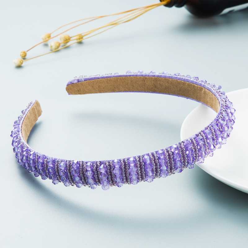 Lavender translucent beads in hand-woven rows