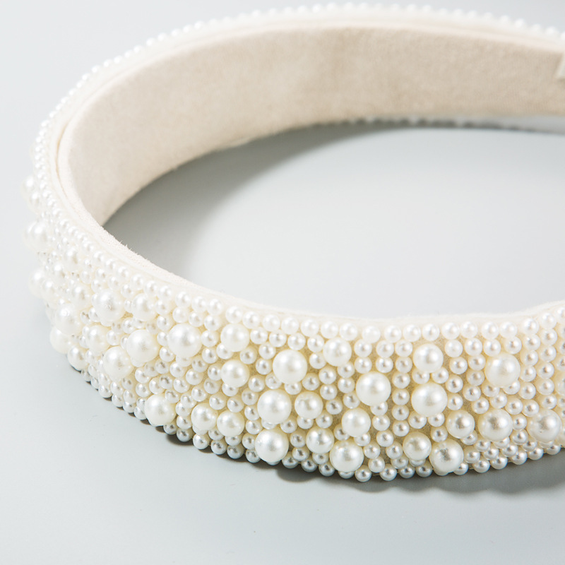 Layered glossy faux pearls on ivory fabric headband