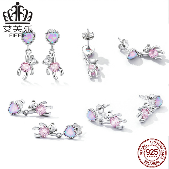 These earrings feature a unique design: a sterling silver heart shape with opal accents and a small bear engraved into the heart. Crafted from durable sterling silver, the earrings are finished with a bright polished shine and secure latch closure. Show off your style with this one-of-a-kind design and the long-lasting shine of sterling silver.