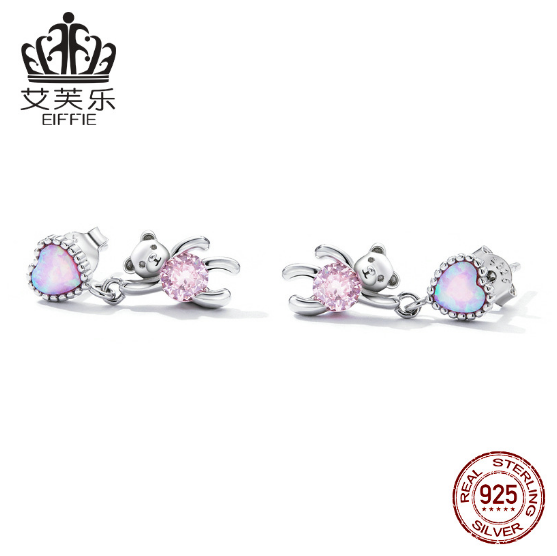 These earrings feature a unique design: a sterling silver heart shape with opal accents and a small bear engraved into the heart. Crafted from durable sterling silver, the earrings are finished with a bright polished shine and secure latch closure. Show off your style with this one-of-a-kind design and the long-lasting shine of sterling silver.