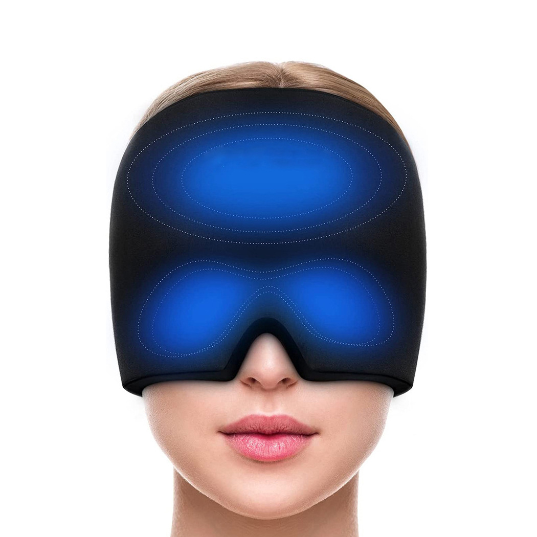 Woman wearing black gel ice mask with illuminated dual blue thermal zones on forehead and eye area, showing precise cooling target areas