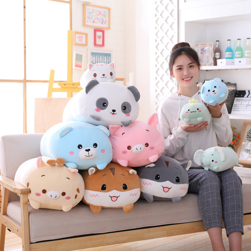 Close view of elongated plush pillow on sofa