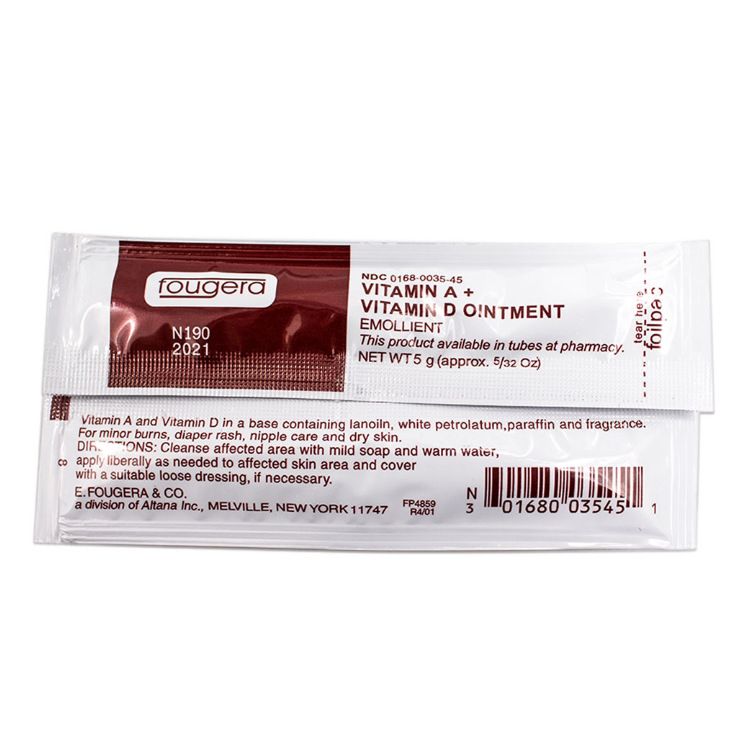 Individual sachet close-up showing Fougera branding, Vitamin A + Vitamin D Ointment labeling, usage instructions, and NDC code